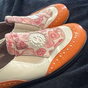 Madison Women's Orange and Cream Slip-On Brogue Flats for golf